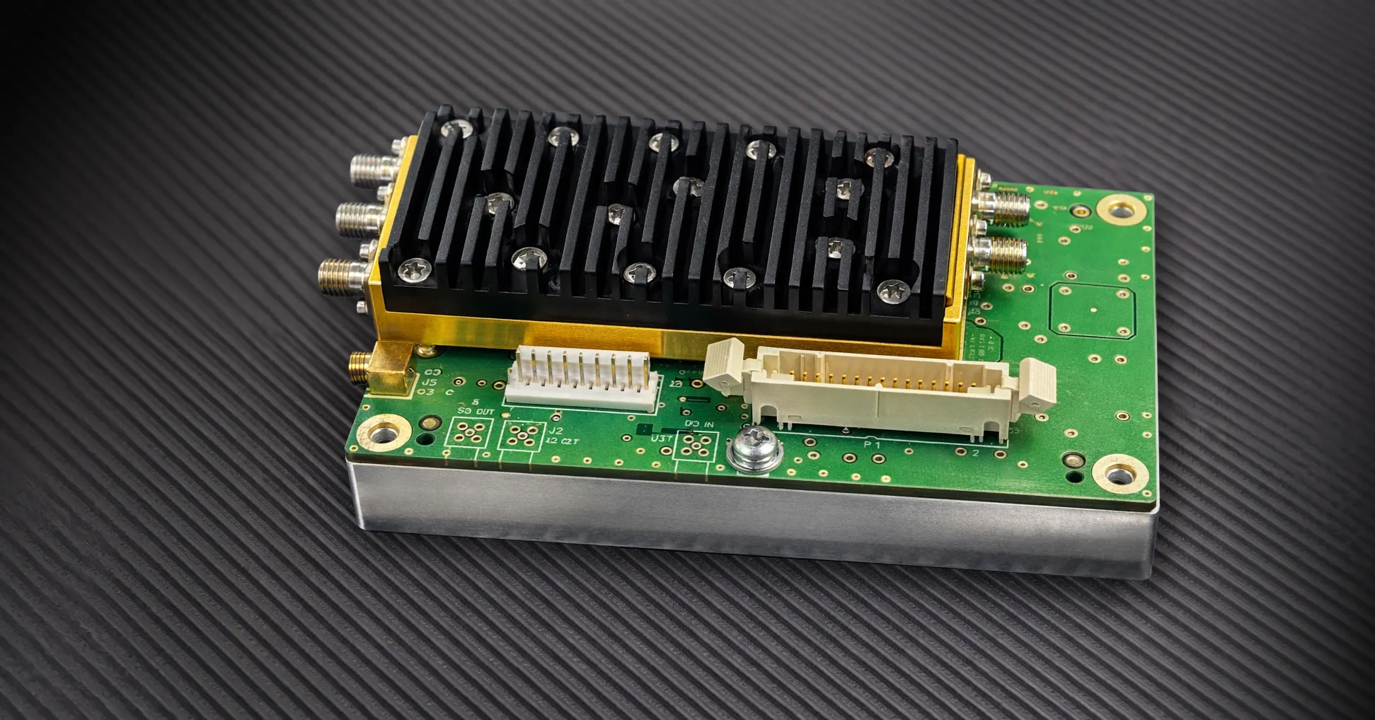 Microsource microwave module housing with RF interconnect
